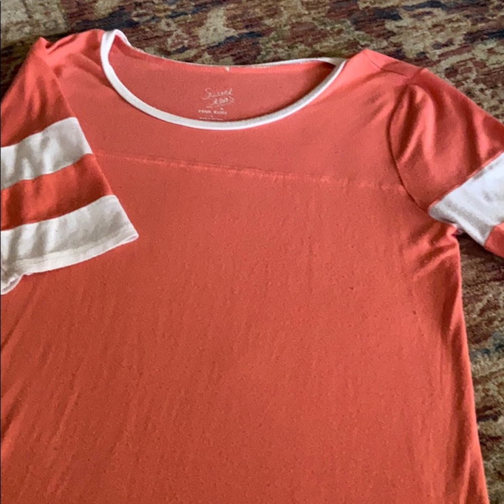 A pink shortsleeved shirt!